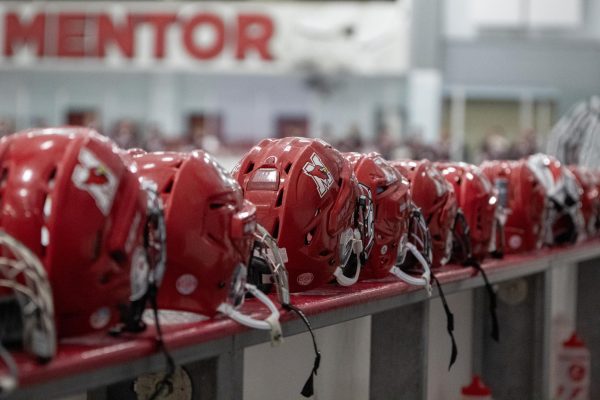 Line of player helmets on bench from home game against Rocky River High School on December 15, 2023.
