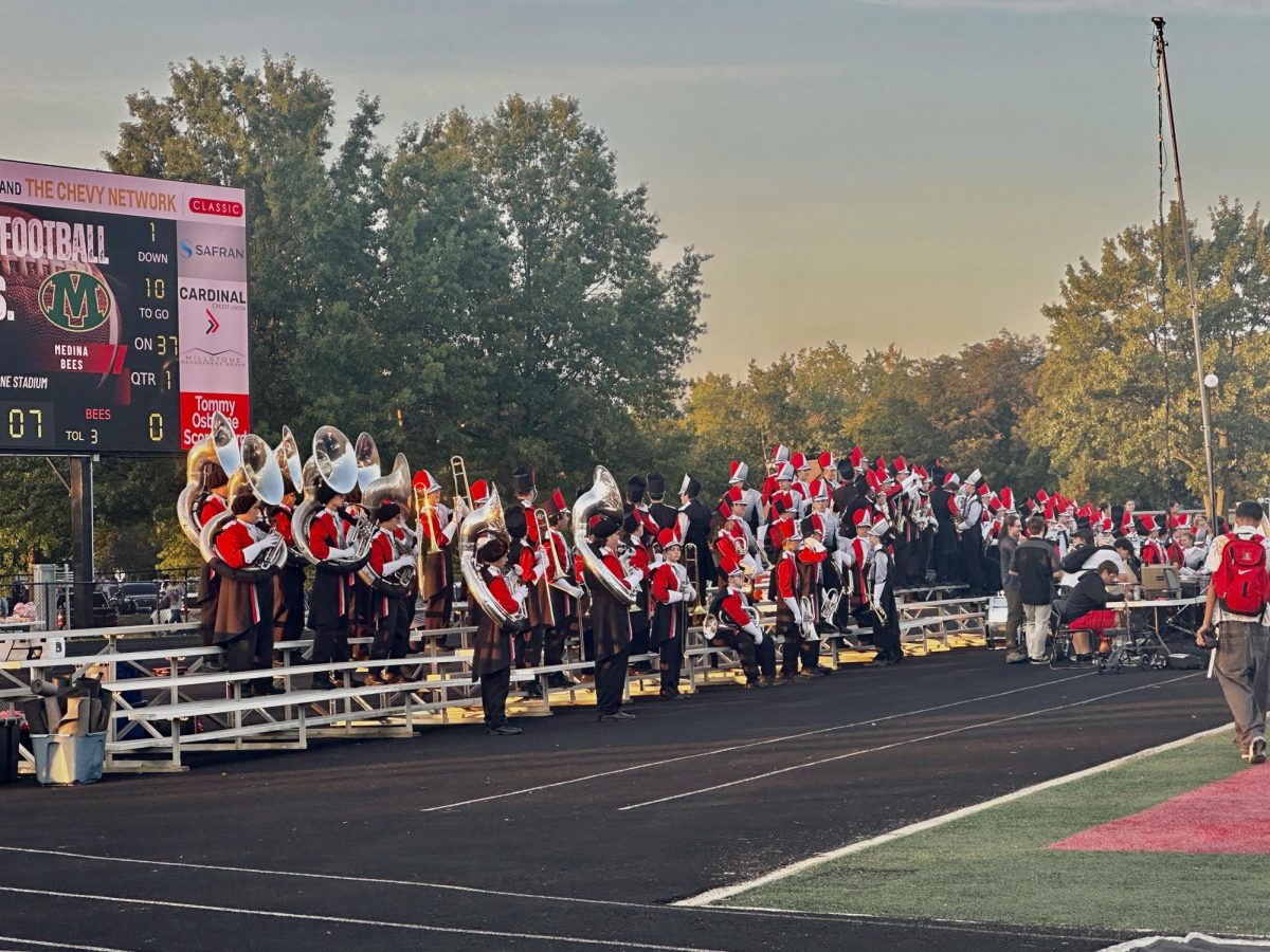 Mentor Cardinals Marching Band by the stands.