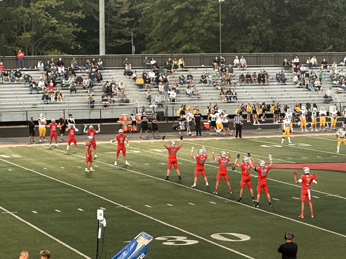 Mentor High School football team on the field. 