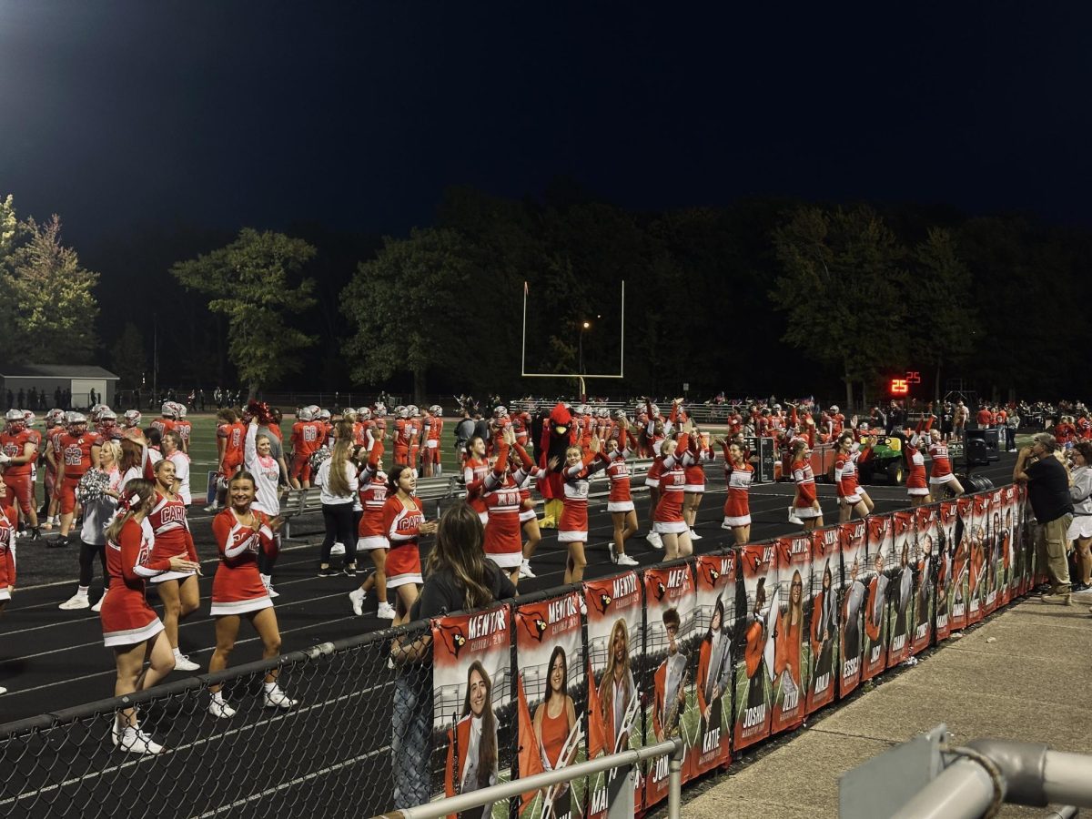 Mentor cheerleaders rallying fans during the game.
