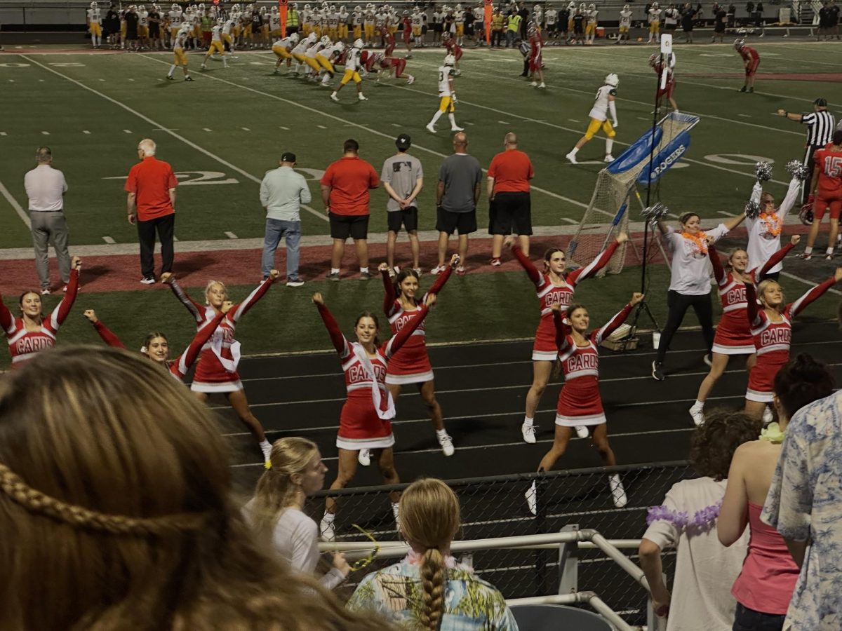 Cheerleaders leading the Cards with spirit. 