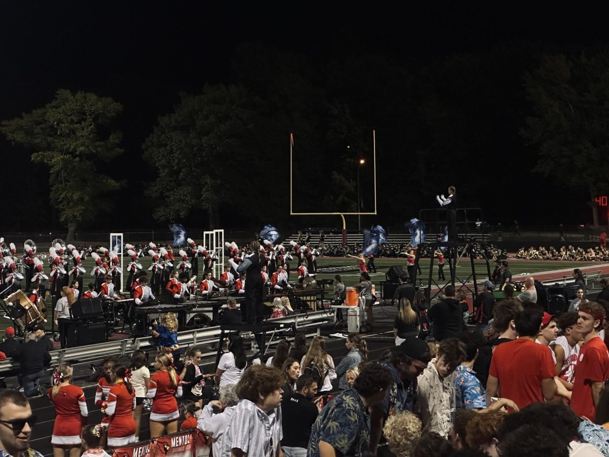 Mentor marching band performs under the conduction of drum majors.