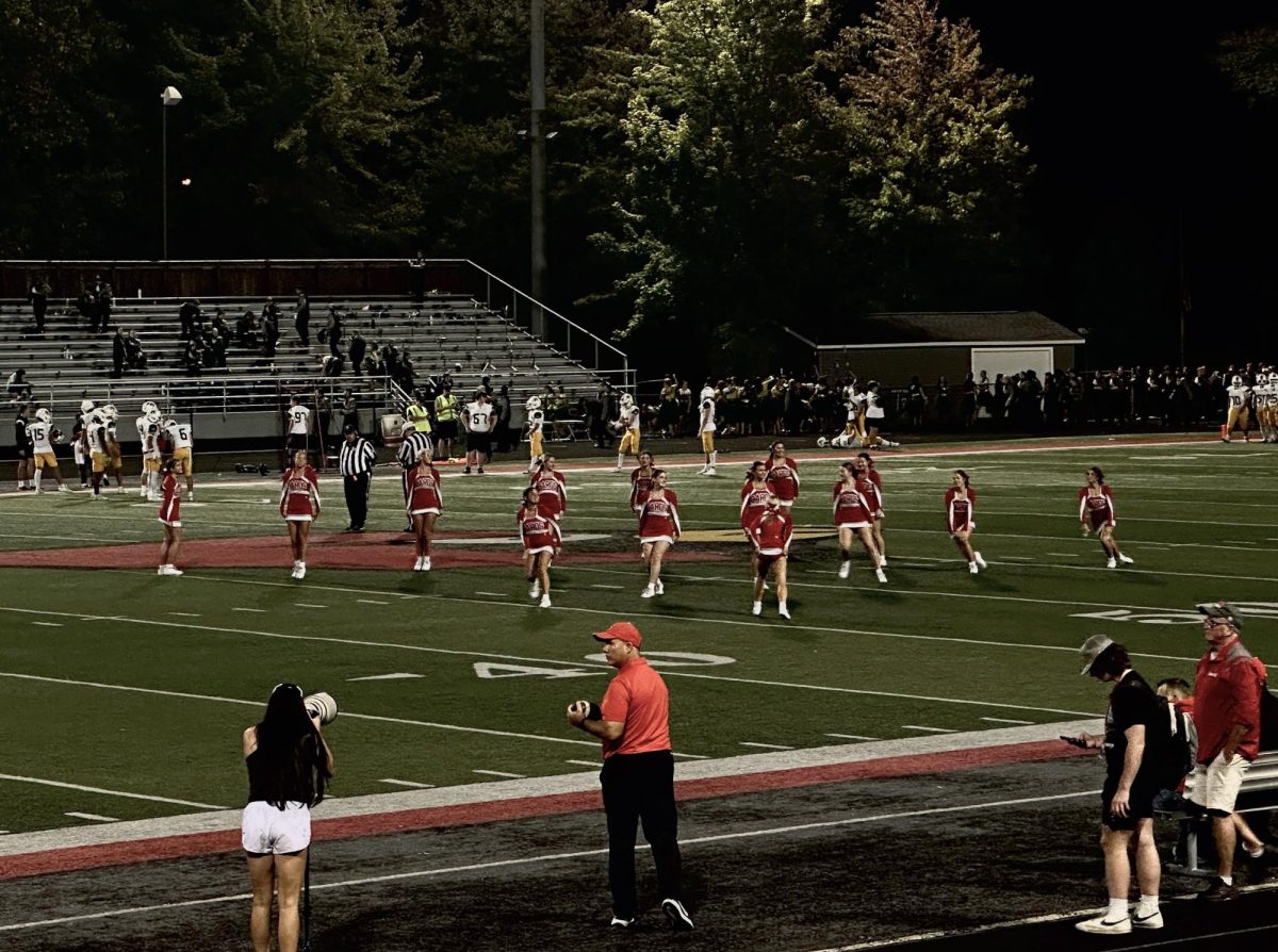 Mentor Varsity Cheerleaders performing their halftime routine on the field