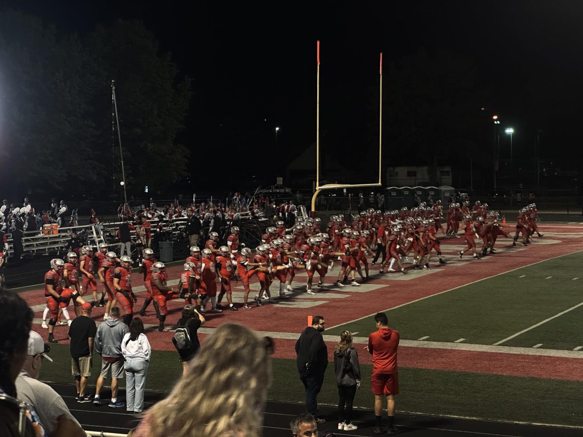 Mentor players warming up for the quarter three.