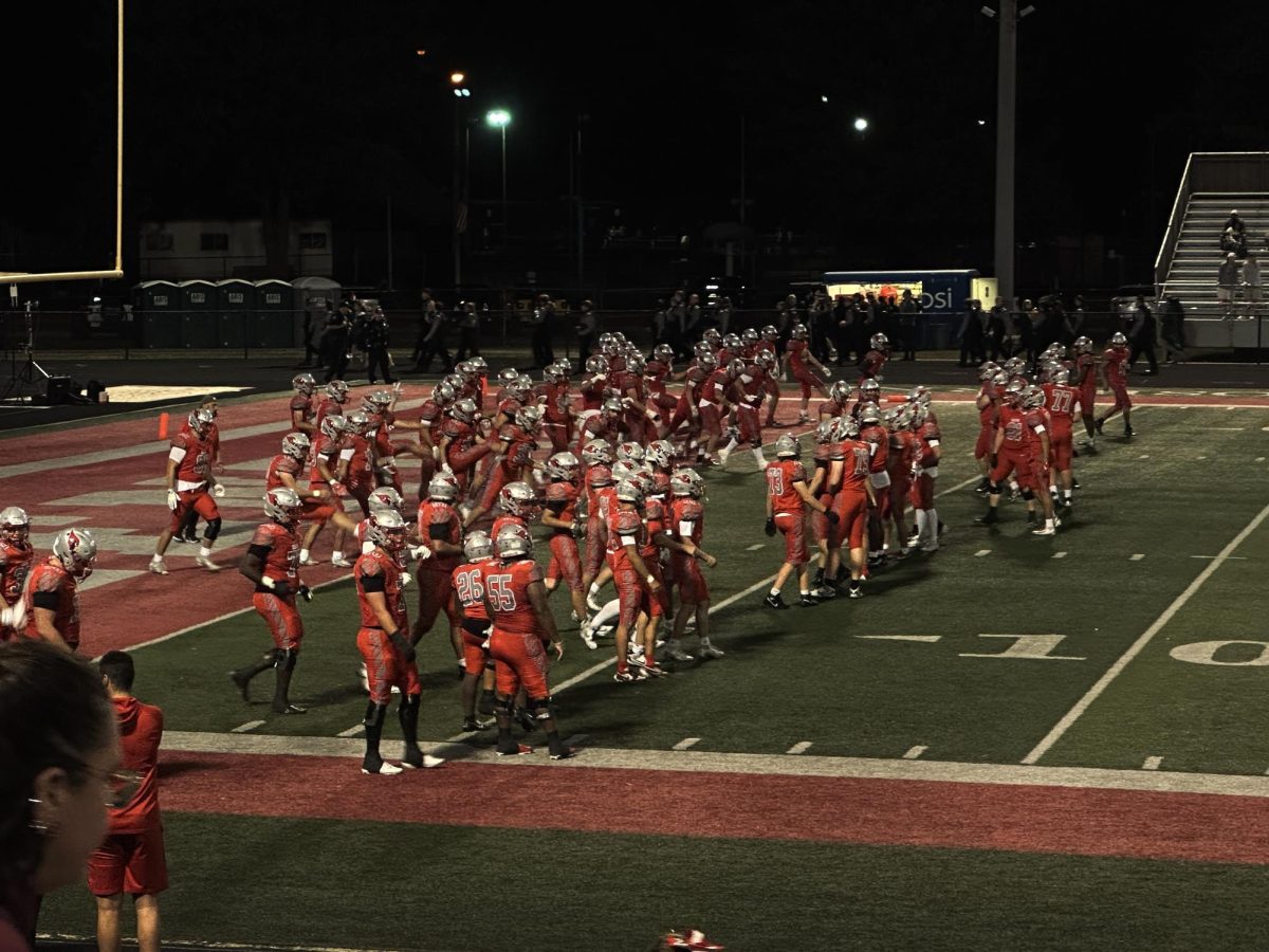 Mentor players warming up for quarter three. (2)