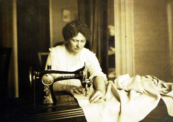 Woman Sewing in black and white vintage picture - GetArchive (Public Domain)