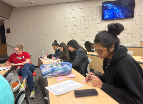 Future Leaders writing positive messages for the Valentine's heart cards.